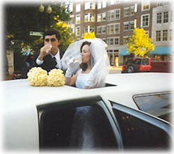 Married Couple Toasting Champagne through a Limo Moon Roof